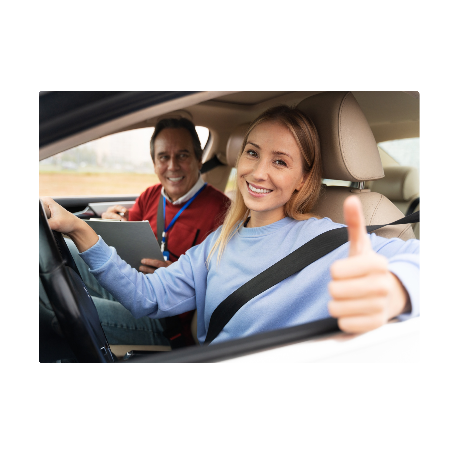 Happy learner driver with her instructor